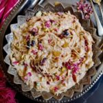 sheer khurma recipe, how to make sheer kurma, Close up image of sheer Qorma garnished with almonds, raisins, dry rose petals.